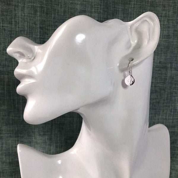 small silver drop earring with hammered finish. 8mm wide sterling silver discs