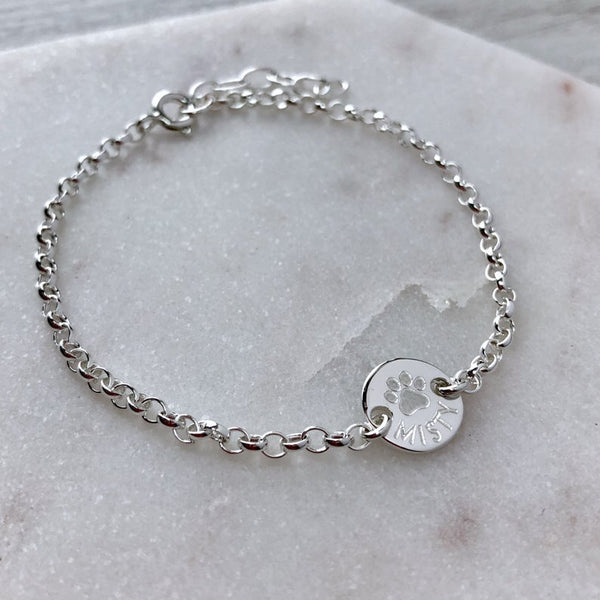 Paw print bracelet personalised with pets name, sterling silver