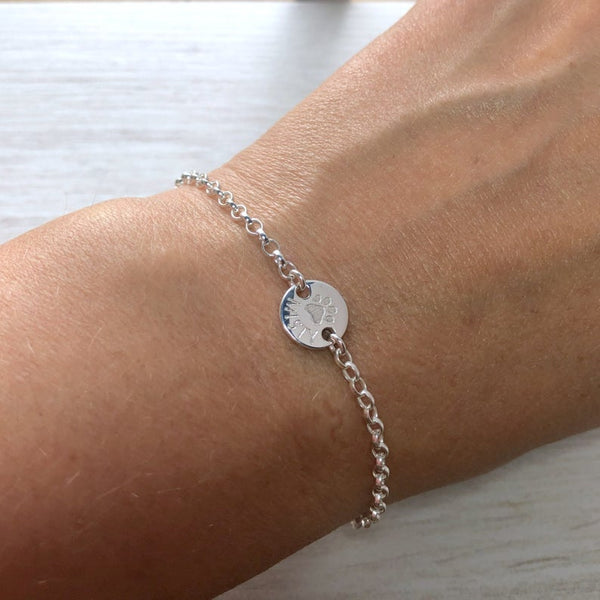 Paw print bracelet personalised with pets name, sterling silver