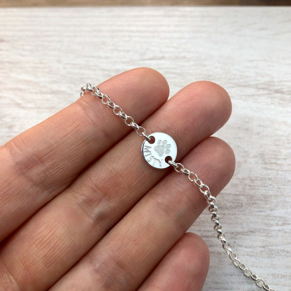 Paw print bracelet personalised with pets name, sterling silver
