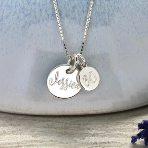 Engraved silver 30th birthday necklace with 2 pendants: 12mm disc with name, 8mm disc with age.
