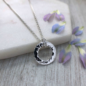 sterling silver washer necklace with hammered surface finish