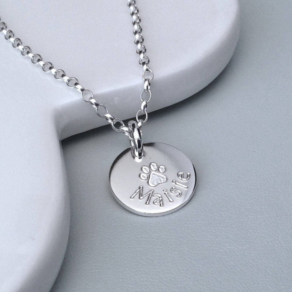Paw print necklace engraved in sterling silver