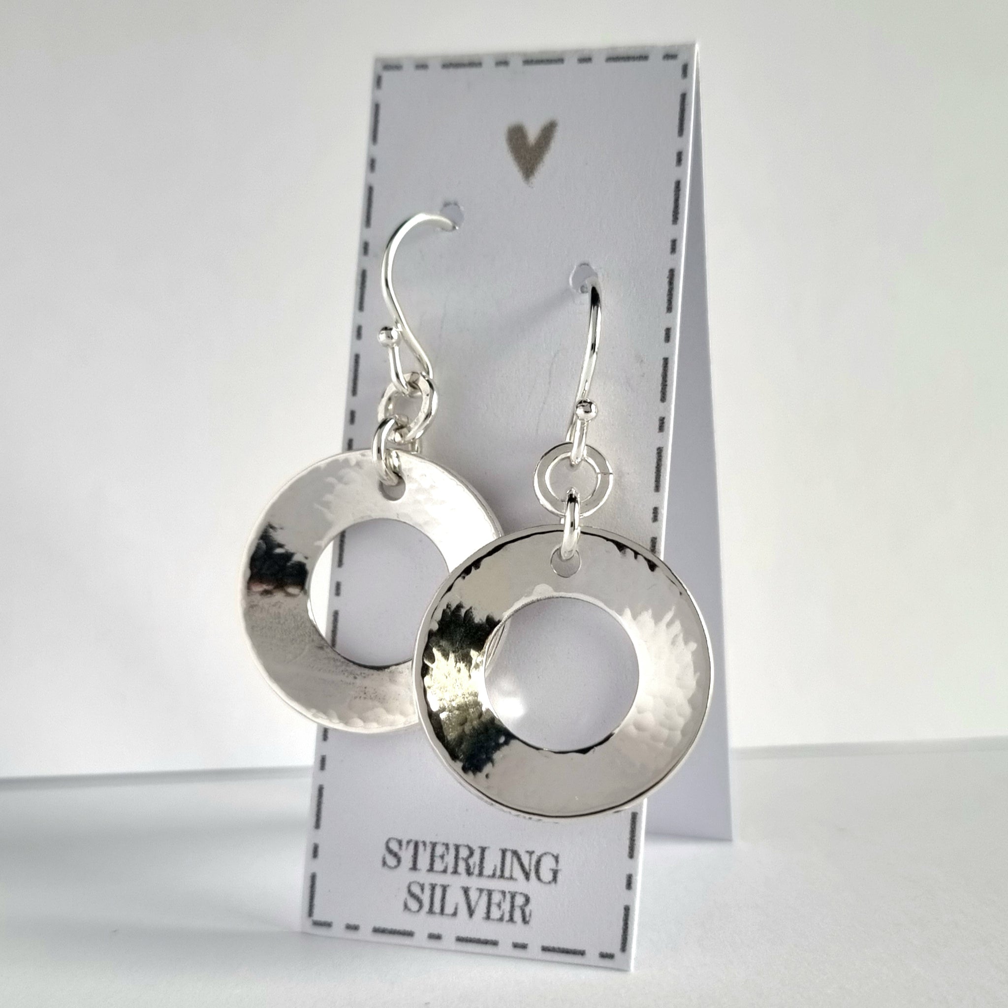 Sterling silver washer style earrings, 2cm in diameter. The washers have been softly hammered and domed to create a gentle concave shape.