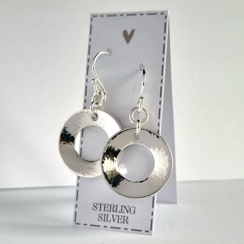 Sterling silver washer style earrings, 2cm in diameter. The washers have been softly hammered and domed to create a gentle concave shape.