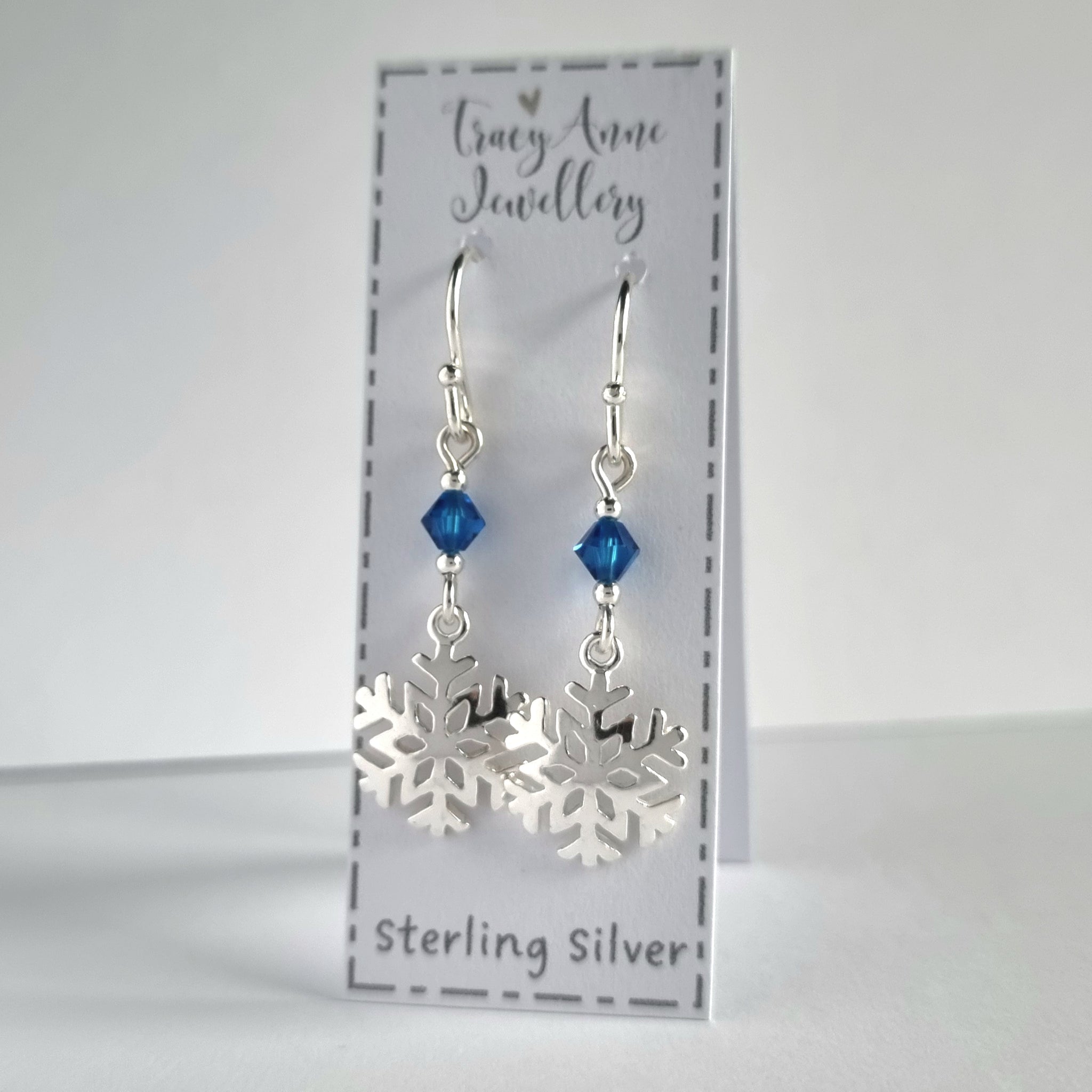 Sterling silver snowflake drop earrings with tiny blue crystal beads