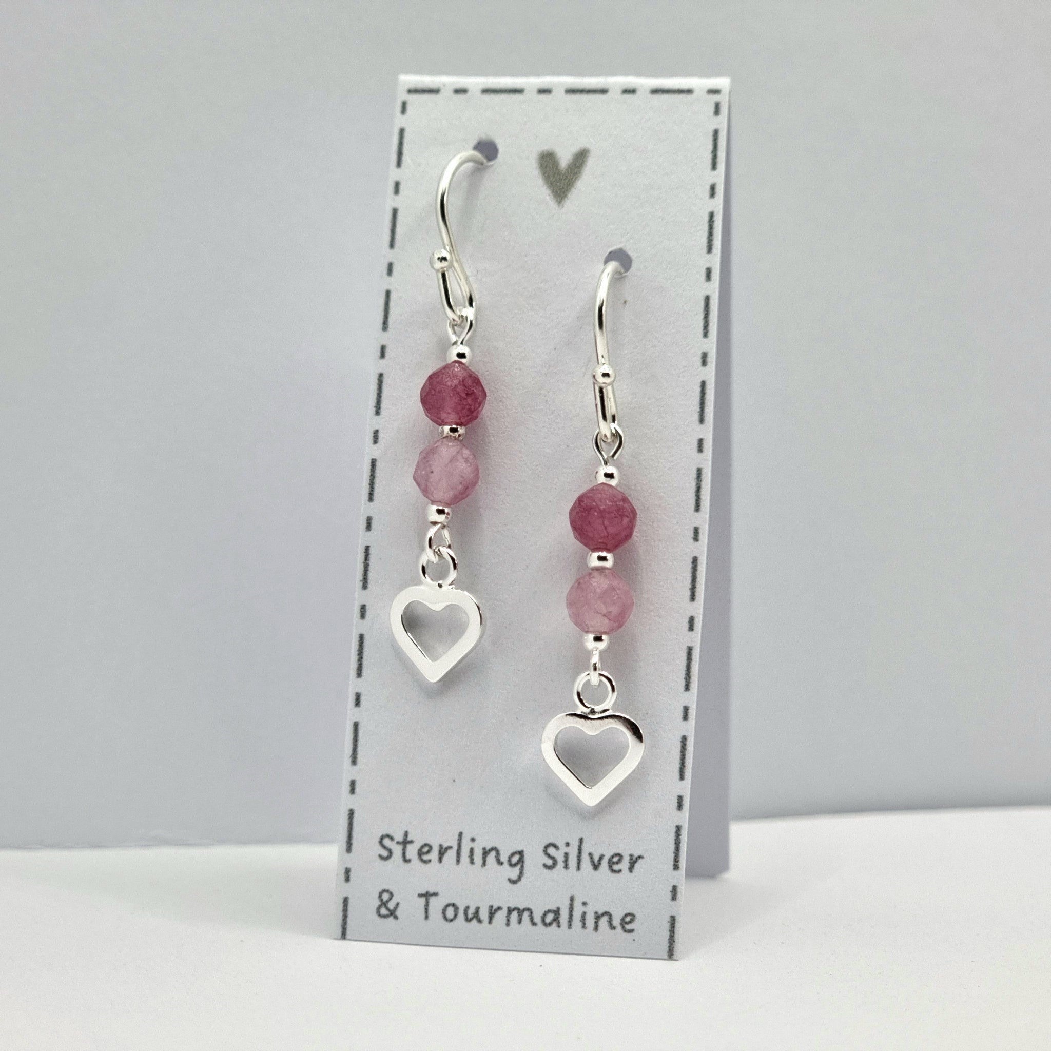 Lovely dainty drop earrings, with small sterling silver hearts and tiny tourmaline gemstones in shades of dark and pale pink.