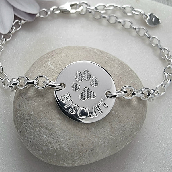 Actual paw print bracelet, your dog or cat's paw and their name will be engraved onto a lovely sterling silver bracelet featuring a 15mm wide disc