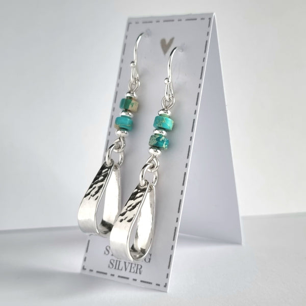Sterling silver earrings. Hammered teardrop loops suspended from sea-sediment jasper beads, tribal boho style