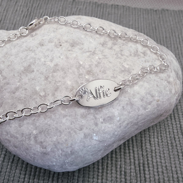 Paw print bracelet with pets name, personalised sterling silver
