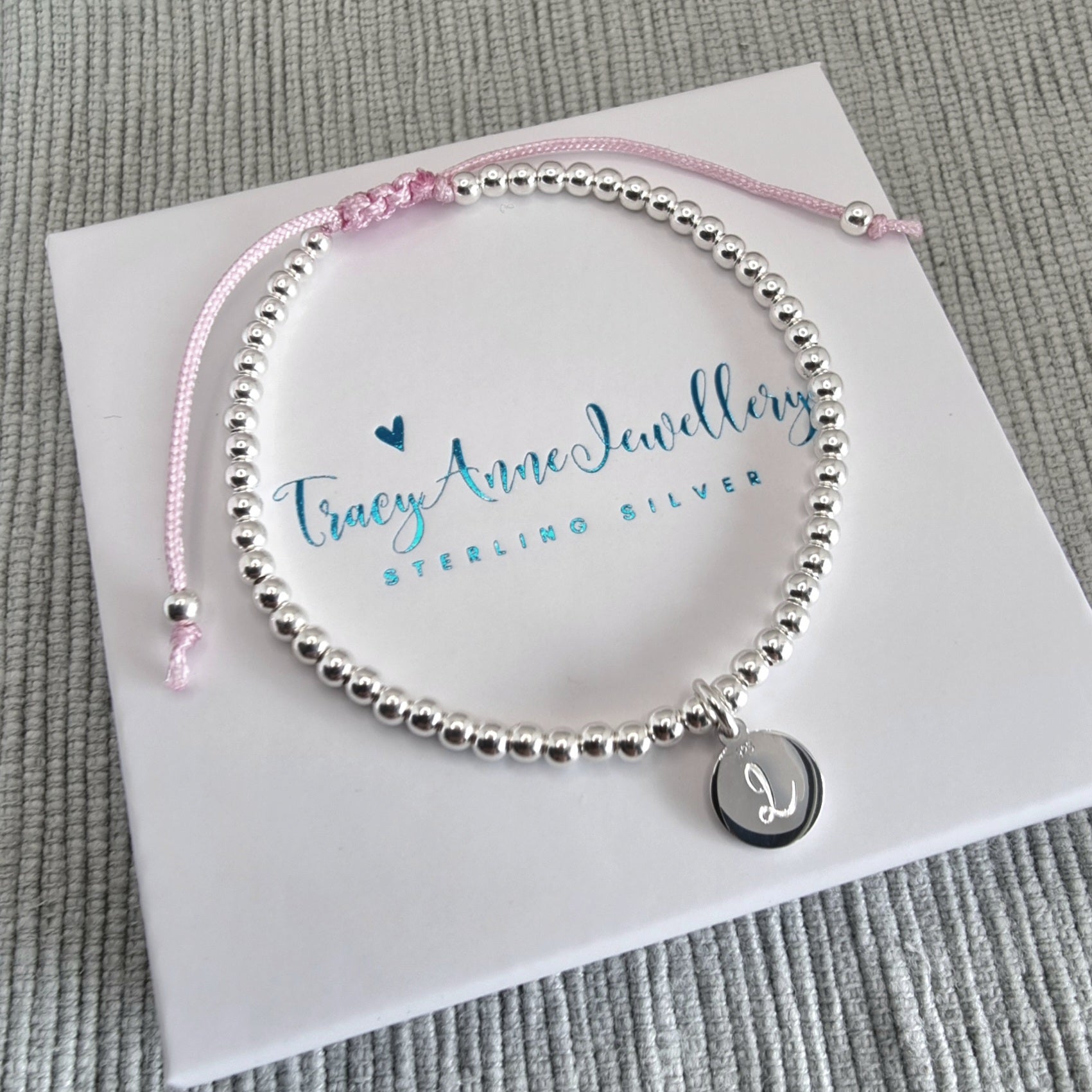 Sterling silver bead bracelet with personalised charm
