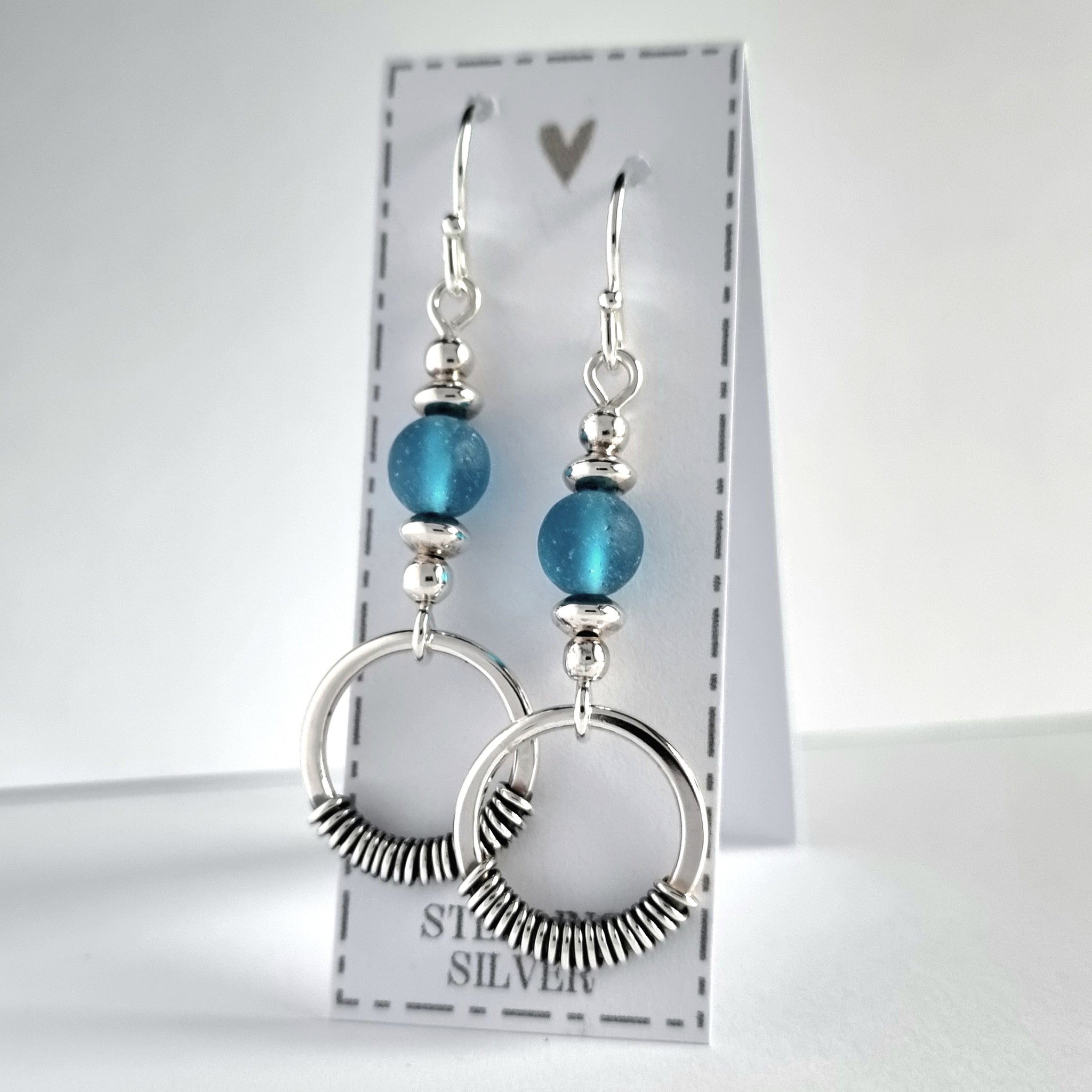 Handmade sterling silver earrings with blue, recycled glass beads