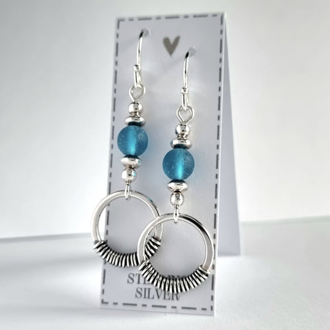 Handmade sterling silver earrings with blue, recycled glass beads