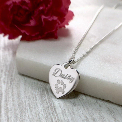 Your own pets paw print engraved on a sterling silver heart with name engraved above. Lovely memorial gift to remember a much loved pet.