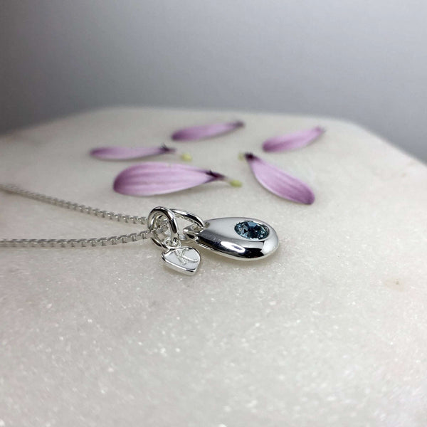 Birthstone necklace with teardrop pendant and tiny monogram heart charm