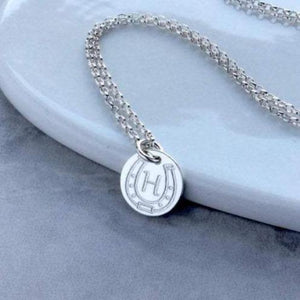 horseshoe necklace with initial engraved in centre of horseshoe, sterling silver