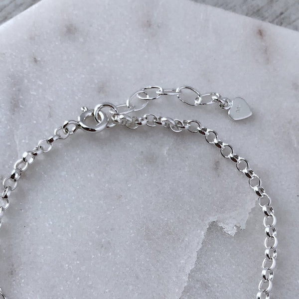 Paw print bracelet personalised with pets name, sterling silver