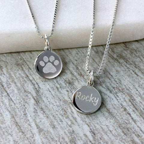 tiny paw print necklace with pet's name engraved on the back, 8mm wide