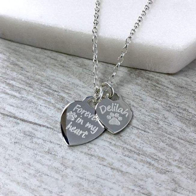 Pet memorial necklace with two sterling silver hearts. Forever in my heart on one and your pet's name on the second.